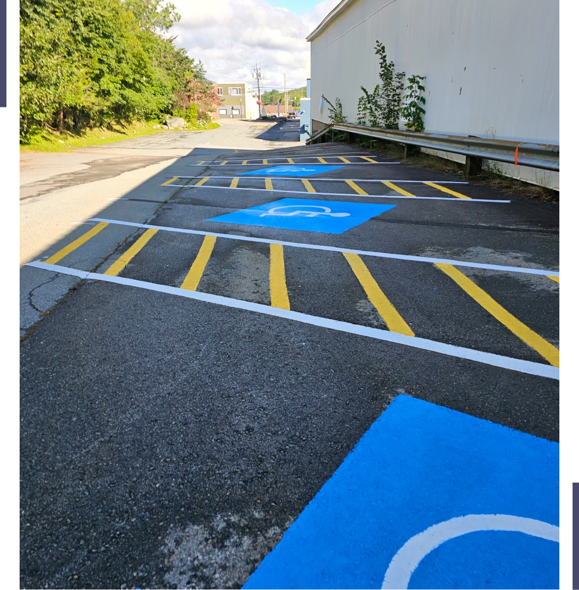 Parking spaces designated for disabled individuals with clear blue and yellow markings.
