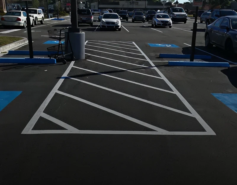 Empty parking lot with designated handicapped spaces and clear white striping.